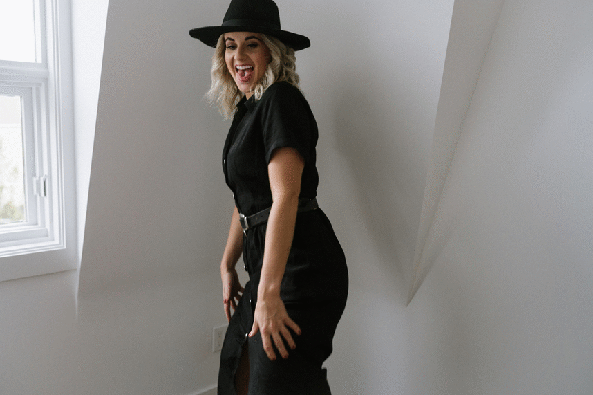 GIF of a blonde babe in a fancy black hat twerking as she gets excited about pepper marketing services.