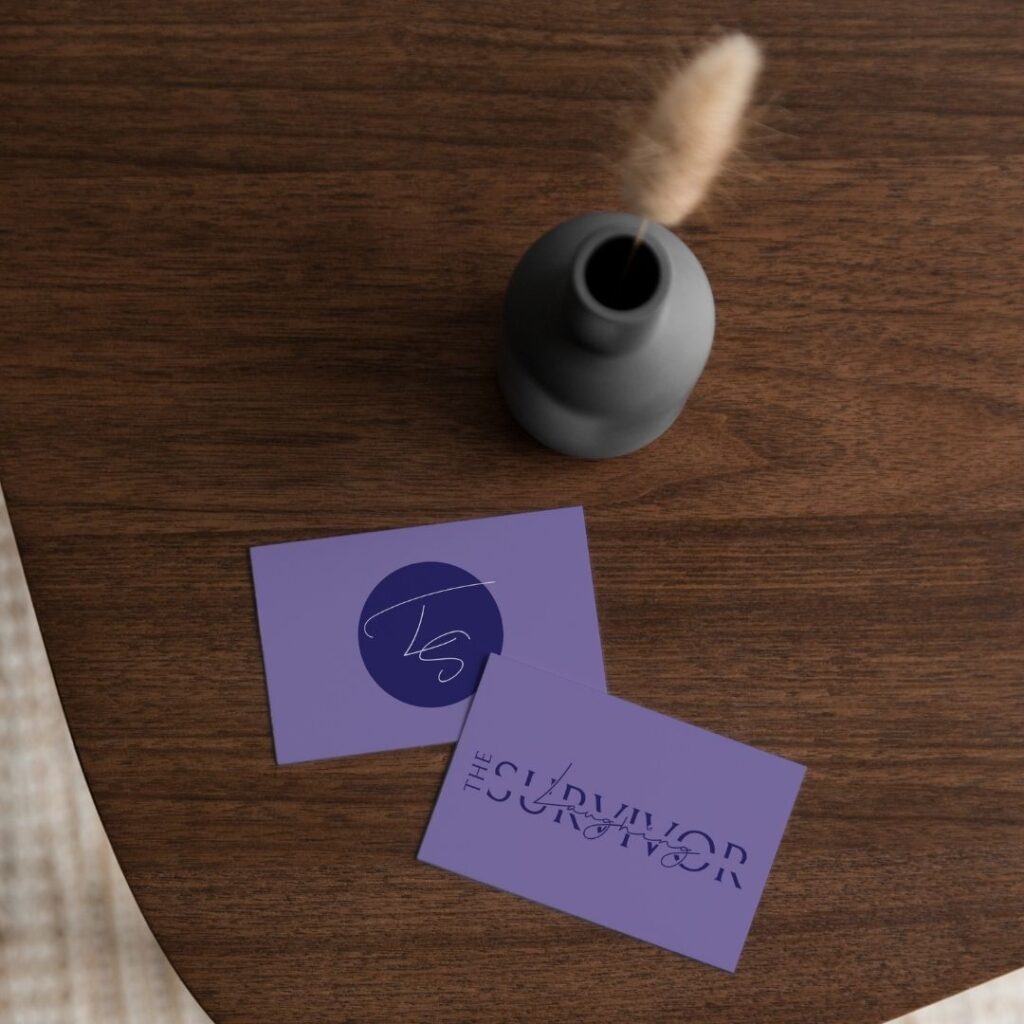 the laughing survivor logo created by meet pepper on business cards on a table