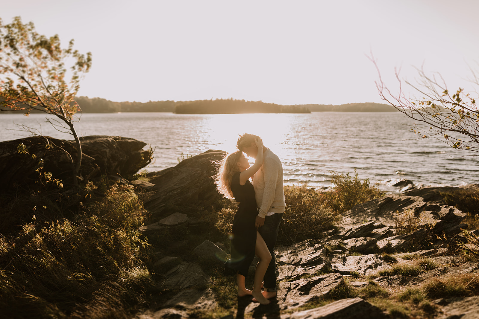 man and woman get close next to Lake Muskoka in Ontario Canada for Ally and Nicolas Photography in an image sent in a newsletter created by meet peppers newsletter services