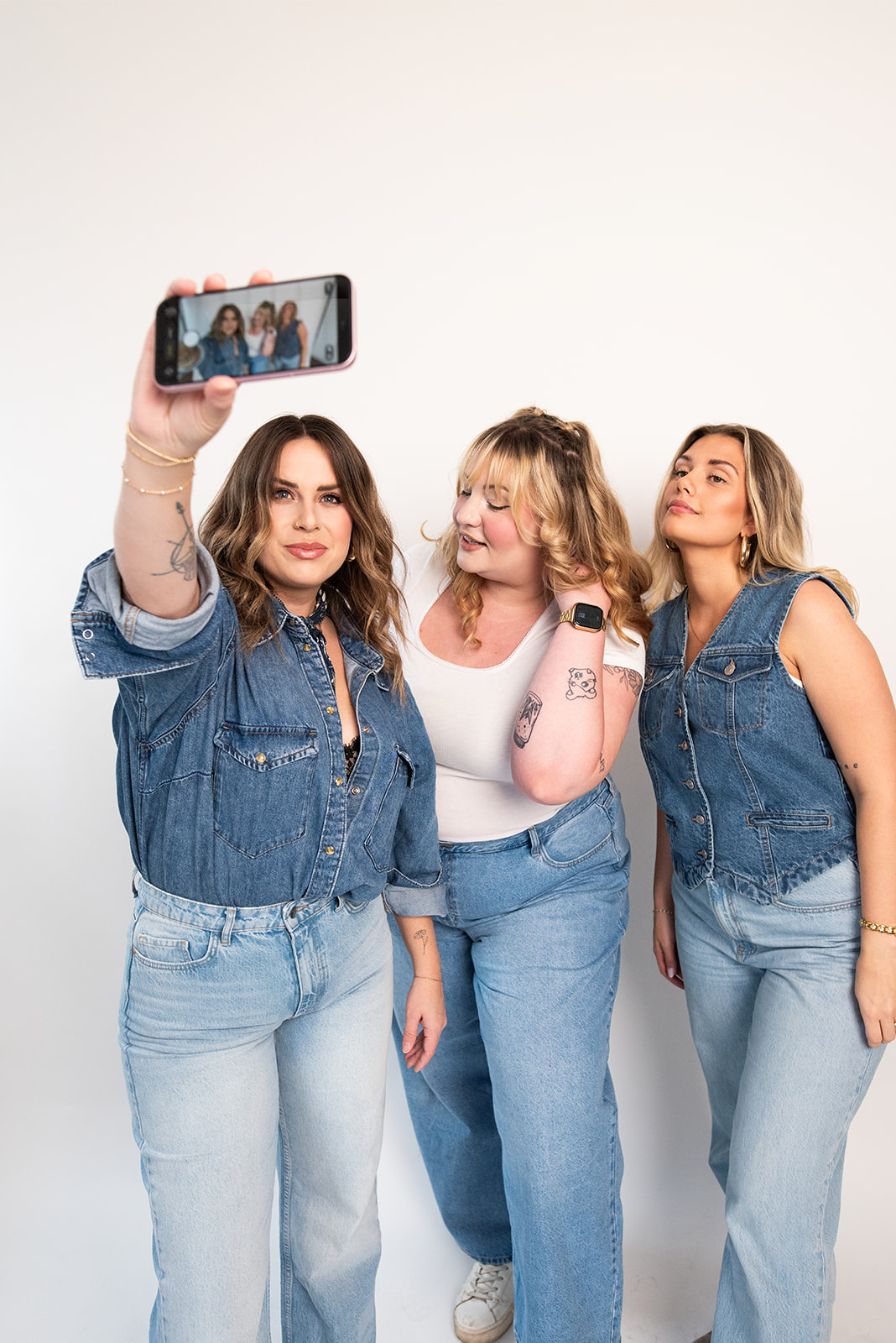 Pepper marketing team capturing selfie together in studio, showcasing women-led marketing agency culture in Kamloops
