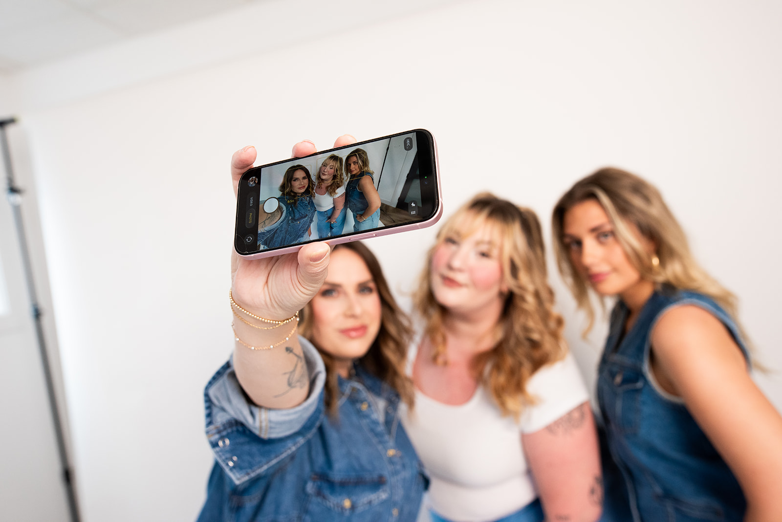 Pepper marketing team taking a selfie during a content shoot, highlighting team culture and social media content creation in Kamloops