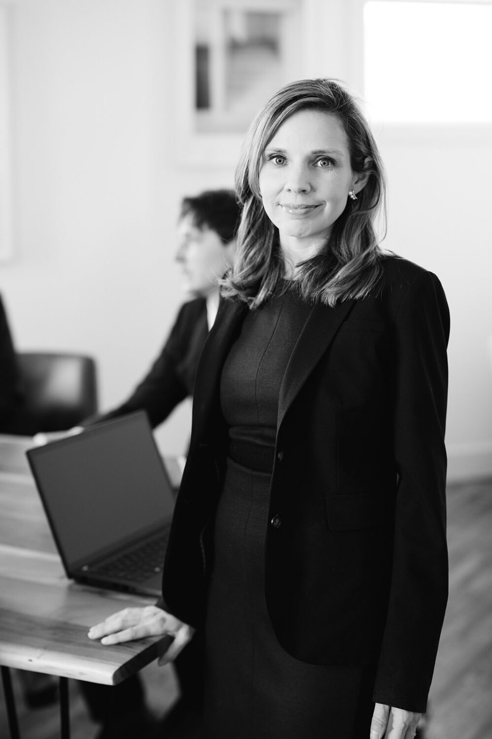 GoodWin Law team member working at a desk in a professional law office