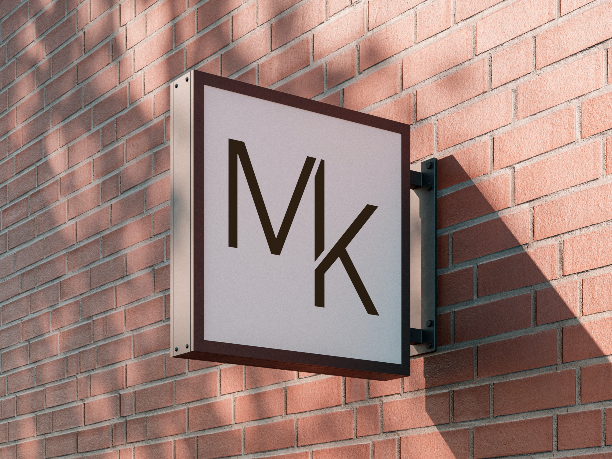 Madok Developments MK submark, created by Pepper, displayed on an exterior sign mounted to a red brick wall.