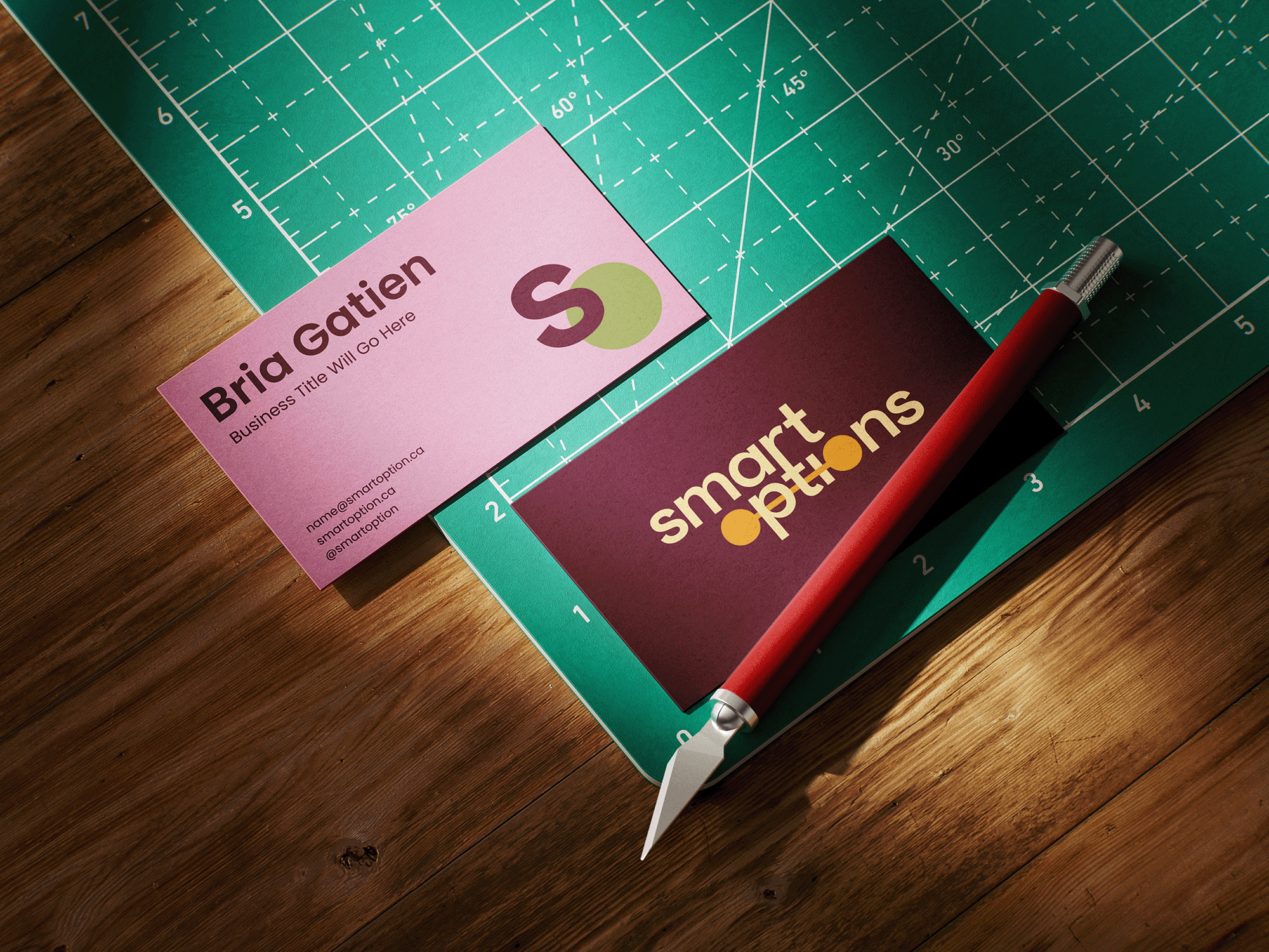 Smart Options business cards featuring the refreshed pink, burgundy, green, and yellow brand identity created by Pepper through a Brand Refresh.