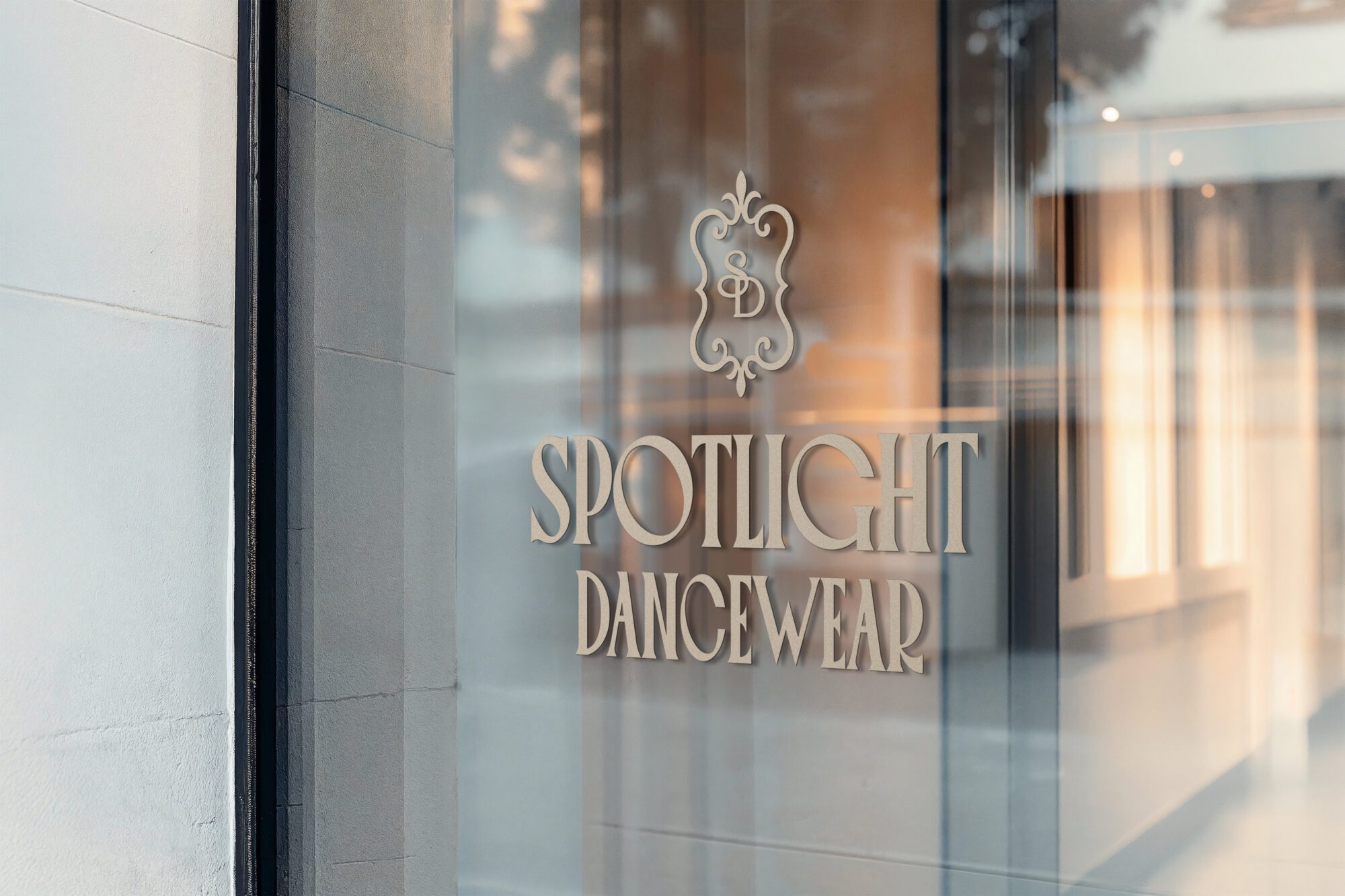 Spotlight Dancewear storefront window signage displaying the custom logo and branding designed by Pepper Marketing.